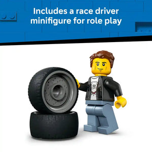 LEGO minifigure race driver with brown hair and black leather jacket standing next to large black racing tires with gray metal rims, promoting the included race driver figure for role play in the LEGO Hot Rod set 60485