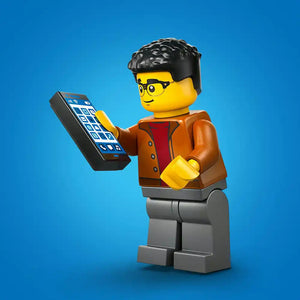 LEGO minifigure with black hair and yellow face wearing orange jacket and red shirt holding blue mobile device against blue background