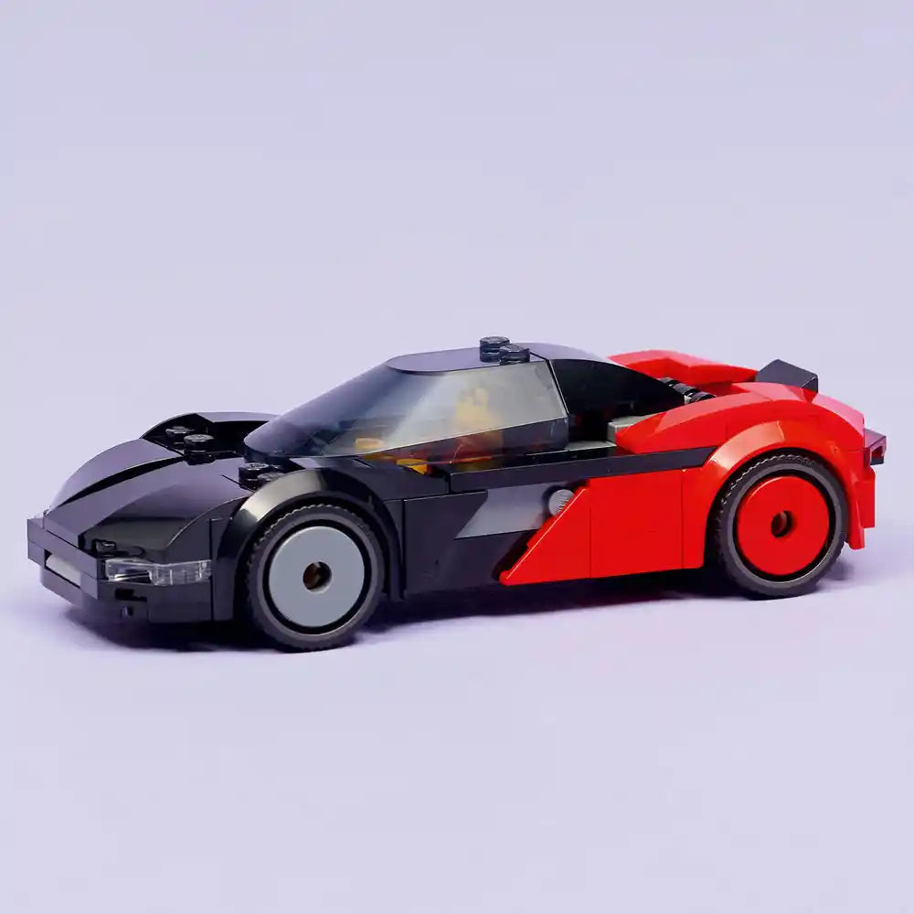 LEGO EV Supercar model 60486 featuring a sleek sports car design with black and red plastic brick construction, open red door, detailed windshield and wheels, displayed against a neutral light purple background