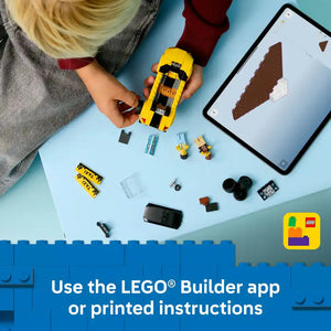 Child assembling LEGO Yellow Taxi set 60487 with instruction guide on tablet, displaying yellow taxi model, minifigures, batteries, and individual brick components on light blue surface