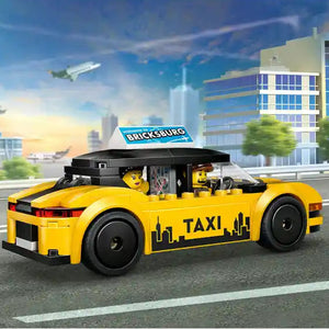 LEGO yellow taxi car set 60487 with black roof and taxi markings, featuring minifigures and Bricksburg sign, displayed in urban cityscape scene