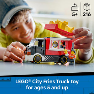 Child holding red and black LEGO City Fries food truck toy with yellow French fries on roof, featuring checkered design and minifigure, 216 pieces, ages 5+