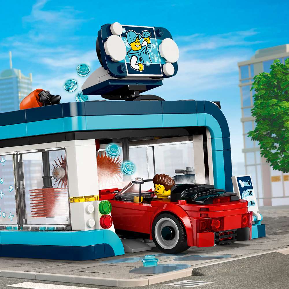 LEGO City Drive-Through Car Wash 60497 red convertible driving into the car wash entrance, showing the blue archway and brush rail