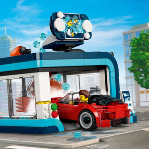LEGO City Drive-Through Car Wash 60497 red convertible driving into the car wash entrance, showing the blue archway and brush rail