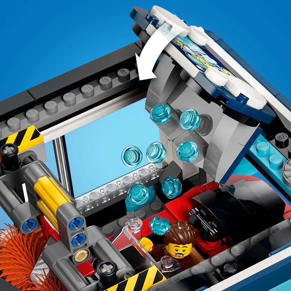 LEGO City Drive-Through Car Wash 60497 detail of the wash mechanism, showing the sliding rail that spins the brushes and the water pellet function