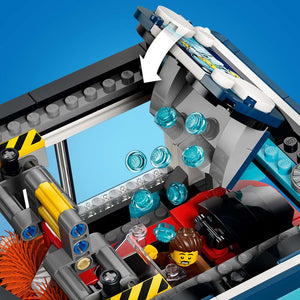 LEGO City Drive-Through Car Wash 60497 detail of the wash mechanism, showing the sliding rail that spins the brushes and the water pellet function