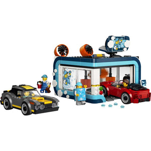 LEGO City Drive-Through Car Wash 60497 fully built model on its own, with blue roof, rotating cleaning brushes, sliding rail, vacuum station and forecourt