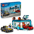 LEGO City Drive-Through Car Wash 60497 set shown beside its product box, blue and grey car wash building with spinning brushes, two toy cars and minifigures, 583 pieces for ages 6 and up