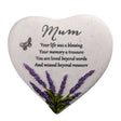 Heart-shaped stone with engraved text and lavender design on a white background