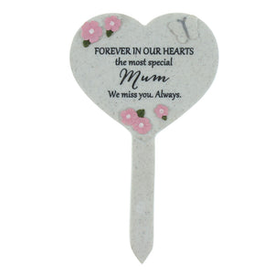 Heart-shaped memorial plaque with floral designs and text on a white background