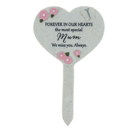 Heart-shaped memorial plaque with floral designs and text on a white background