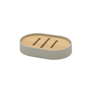 Oval soap dish with ribbed stone gray ceramic base and natural bamboo top featuring three drainage slots