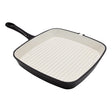 Black cast iron square griddle pan with cream ceramic interior and ridged cooking surface, 23.5cm, featuring a long black handle