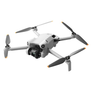 DJI Mini 4 Pro RC 2 compact drone with white and gray body, black propellers with orange accents, mounted camera gimbal, and four propeller arms in isometric product view against white background