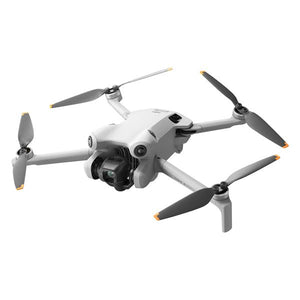 DJI Mini 4 Pro RC 2 compact drone with gray and white body, four propellers with orange and black blades, and integrated camera gimbal shown from angled view against white background