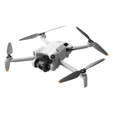 DJI Mini 4 Pro RC 2 compact drone with gray and white body, four propellers with orange and black blades, and integrated camera gimbal shown from angled view against white background