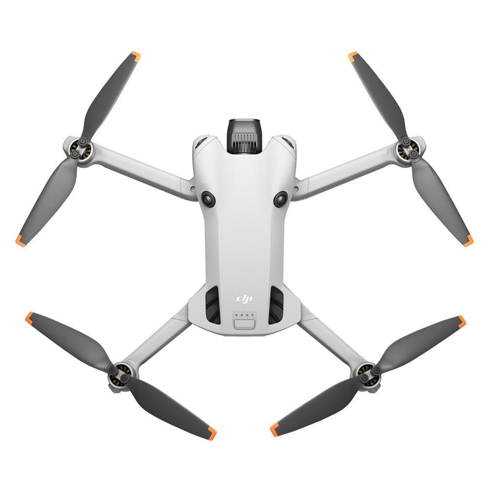 DJI Mini 4 Pro RC 2 drone viewed from above showing white body with gray arms, four black propellers with orange tips, central camera gimbal, and status indicator lights