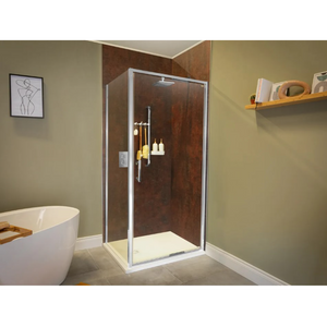 Modern bathroom featuring a chrome-framed glass infold shower door with rust-effect brown wall panels, rectangular rainfall showerhead, and white shower tray, positioned in corner next to freestanding white oval bathtub with wooden bath caddy, sage green walls, grey floor tiles, and minimalist decor including line art print and floating wooden shelf