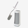 Joseph Joseph Flex Plus toilet brush in grey and white with curved handle, silicone bristles and matching holder caddy displayed against white background
