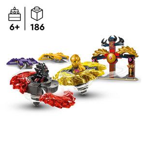 LEGO Dragon Spinjitzu Battle Pack 71826 featuring golden and red spinning battle tops with minifigures, purple dragon vehicle, golden warrior statue, and red temple gate structure against white background