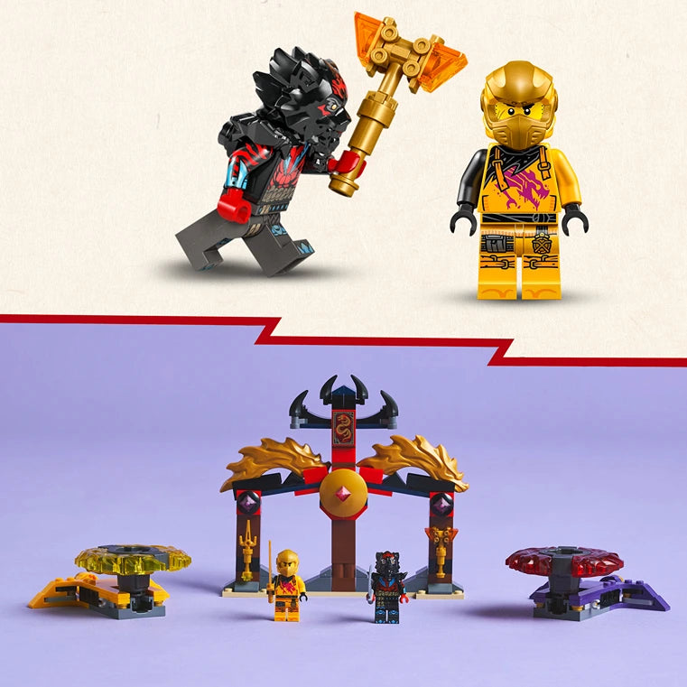 LEGO Ninjago Dragon Spinjitzu Battle Pack 71826 showing golden ninja minifigure, black dragon warrior with axe, temple gateway structure with gold and red details, and spinning battle elements on purple display surface