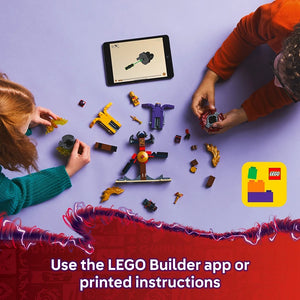Overhead view of two children's hands assembling LEGO Dragon Spinjitzu Battle Pack 71826 on a purple surface, with scattered colorful LEGO pieces including yellow and purple minifigures, a tablet displaying building instructions, and the LEGO app logo in bottom right corner