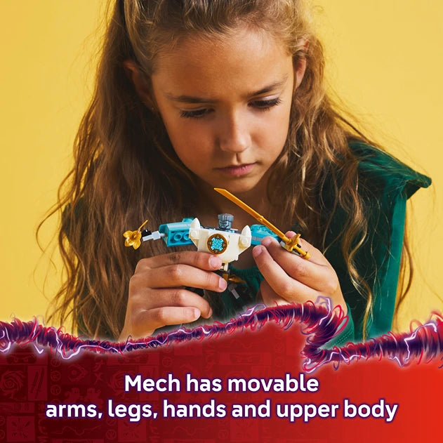 Young girl with long brown hair wearing a green top holding a white and blue LEGO mech figure with movable arms, legs, hands and upper body against a bright yellow background with red decorative elements