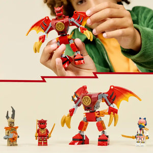 Child holding red and gold dragon mech toy with yellow wings, surrounded by LEGO Ninjago minifigures including Kai in red ninja outfit, small demon character with horns, and colorful warrior figure against beige background