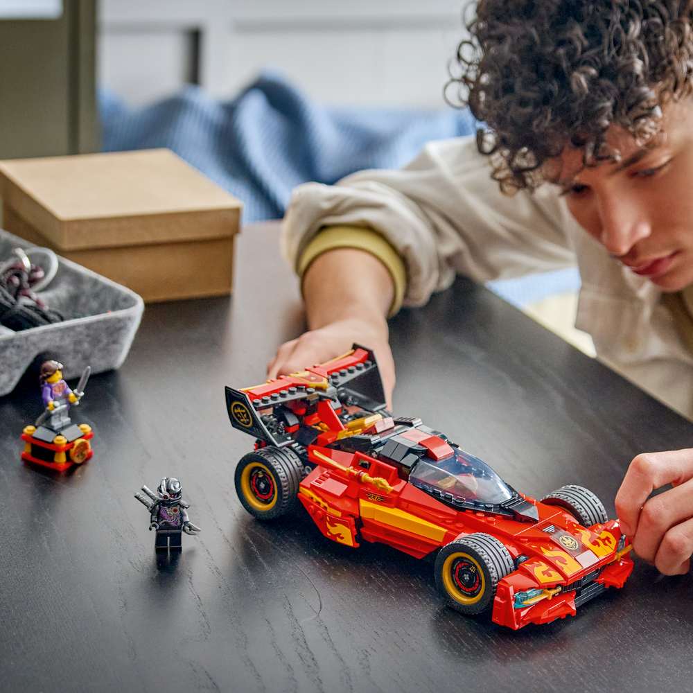 LEGO Ninjago X-1 Ninja Charger 15th Anniversary 71867 - a child playing with the finished build. 691 pieces. Ages 14+.