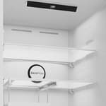 Beko 192cm frost free combi fridge freezer with water dispenser in anthracite grey, interior view showing white shelves and circular temperature control dial