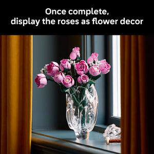 LEGO Bouquet of Pink Roses 10374 displayed in a clear glass vase on a windowsill with pink and magenta rose blooms and white filler flowers, styled as decorative home decor with natural window lighting