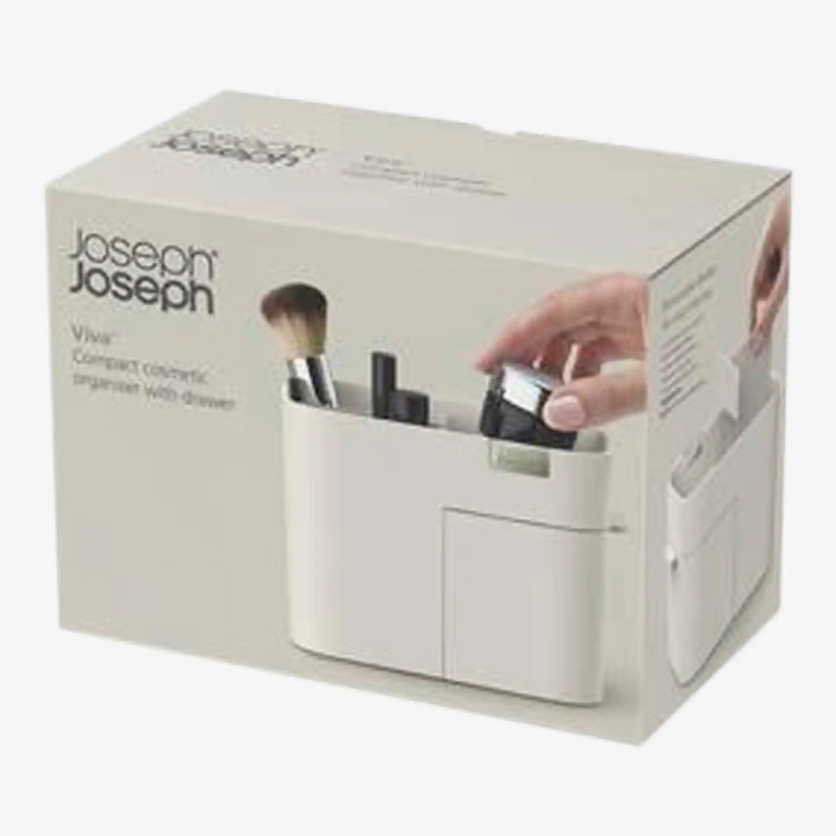 Joseph Joseph Viva white cosmetic makeup organizer with drawer showing brushes and beauty products inside, displayed against cream product packaging box