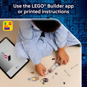 Child's hands assembling LEGO Star Wars Mandalorian speeder bike set with instruction guide on smartphone and printed manual, displaying blue LEGO brick background and scattered colorful components including white, orange, and black pieces