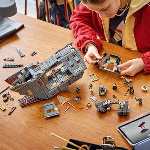 LEGO Star Wars™ Offworld Sandcrawler™ and Mudhorn 75453 - a child building the set. 1683 pieces. Ages 14+.