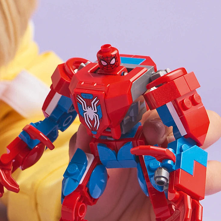 LEGO Spider-Man red and blue mech suit action figure with spider emblem on chest, held in hand against purple background