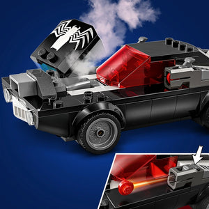 LEGO Marvel Spider-Man vs. Venom Muscle Car set 76309 featuring a black pickup truck with red and white minifigure cars on blue background, includes detailed inset showing red projectile launcher mechanism