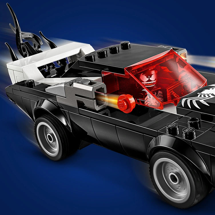 LEGO Spider-Man vs Venom Muscle Car 76309 set featuring black pickup truck with white and red buildable vehicles including white Spider-Man car with opening canopy and red Venom symbiote transport on truck bed against blue background