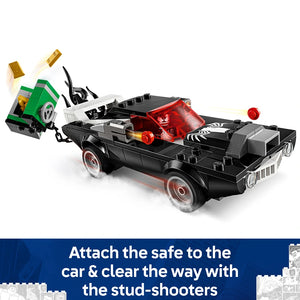 LEGO Spider-Man vs Venom Muscle Car 76309 black muscle car with red stud-shooters and attached green safe playset featuring minifigures and accessories on white background
