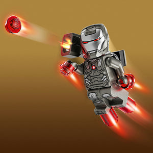 LEGO minifigure of Iron Man in silver and red armor with glowing repulsor beams and rocket boots, firing energy blasts against a gold background