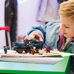 LEGO Super Heroes Spider-Man Prison Transport Chase 76349 - a child playing with the finished build. 367 pieces. Ages 8+.