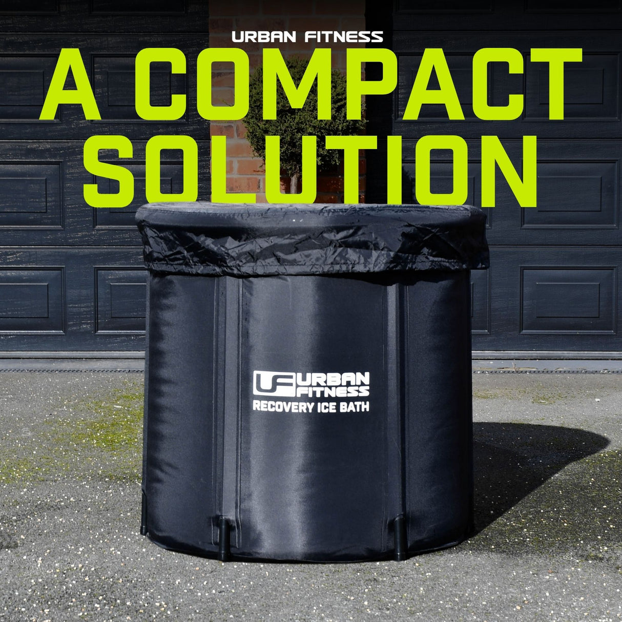 Urban Fitness Recovery Ice Bath black collapsible tub 80cm x 75cm displayed outdoors against dark wooden garage doors with neon yellow text overlay reading A Compact Solution