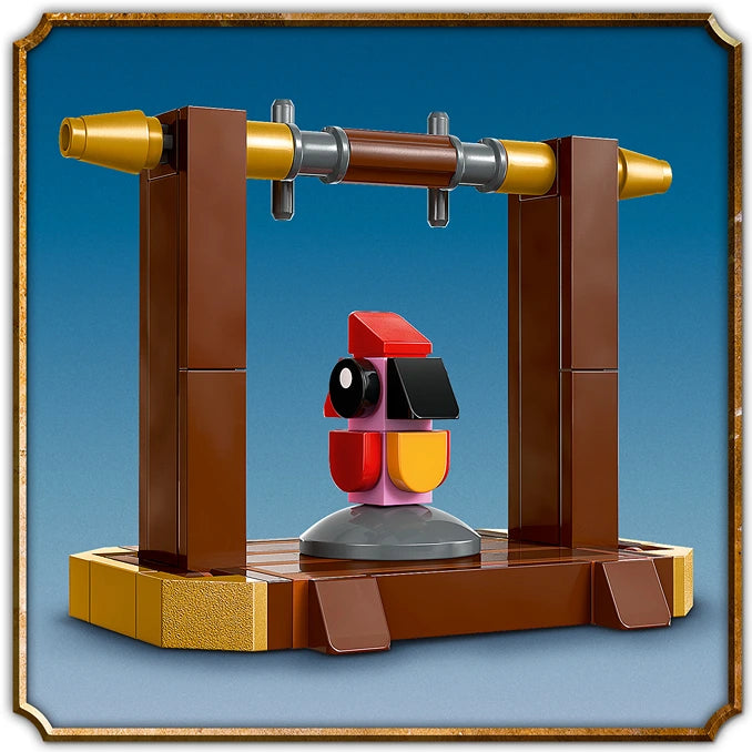 LEGO Fawkes Phoenix set 76448 featuring a colorful red and yellow articulated phoenix figure on a brown wooden platform with dual golden cannons mounted on brown pillars against a blue background