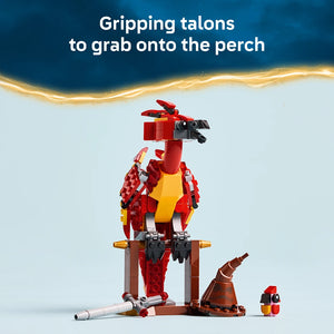 LEGO Fawkes Dumbledore's Phoenix set 76448 featuring a red and yellow brick-built phoenix figure standing on a brown wooden perch, with articulated wings and gripping talons, accompanied by a smaller phoenix minifigure, displayed against a blue and gold gradient background