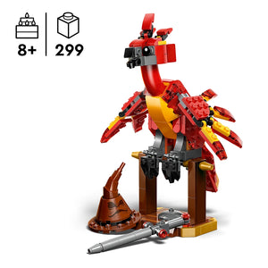 LEGO Fawkes Dumbledore's Phoenix set 76448 featuring a red and gold brick-built phoenix with articulated wings, perched on a wooden stand with accessories including a cannon and launcher, recommended for ages 8 and up with 299 pieces