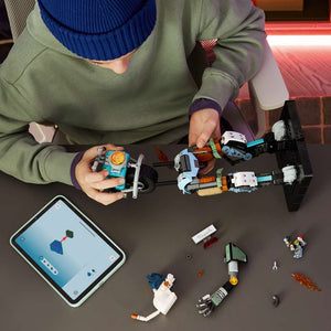 LEGO Fortnite KIT 77081 - a child building the set. 1230 pieces. Ages 12+.