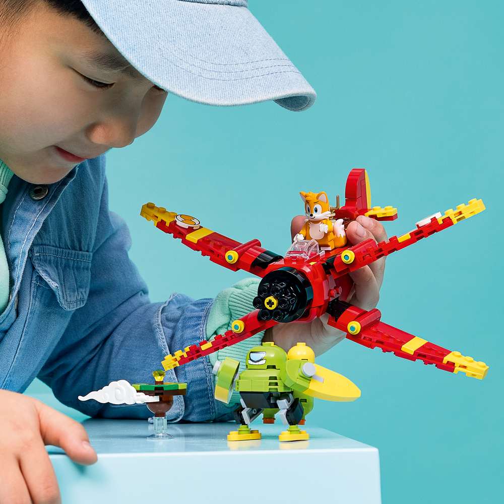 LEGO Sonic Tails' Tornado-1 77119 - a child playing with the finished build. 310 pieces. Ages 8+.
