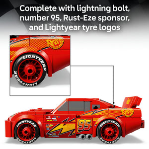 LEGO Lightning McQueen 77255 set showing red race car with number 95, Rust-Eze sponsor logo, Lightyear tyre branding, lightning bolt details, and red wheels displayed in side profile view