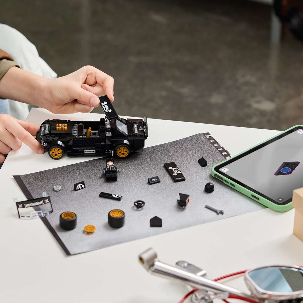 LEGO Speed Champions Ken Block's '65 Ford Mustang Hoonicorn V1 77262 - a child building the set. 345 pieces. Ages 9+.