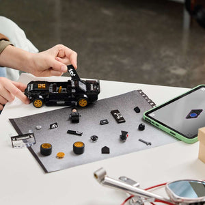LEGO Speed Champions Ken Block's '65 Ford Mustang Hoonicorn V1 77262 - a child building the set. 345 pieces. Ages 9+.