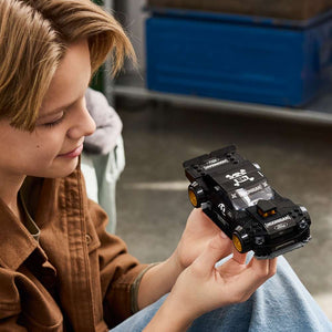 LEGO Speed Champions Ken Block's '65 Ford Mustang Hoonicorn V1 77262 - a child playing with the finished build. 345 pieces. Ages 9+.